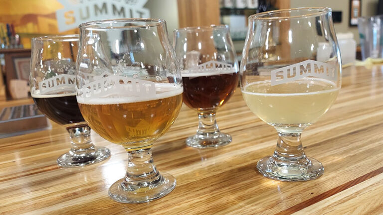 Four NA beers poured in glasses at Summit Brewing Company