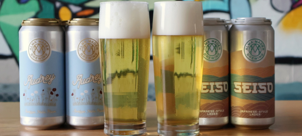 Two rice lagers in cans and glasses from Alma Mader Brewing