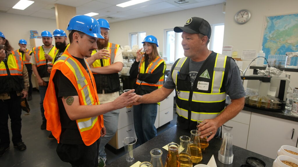 Brewers in QC lab at Rahr Malting Company getting wort from malt steep.