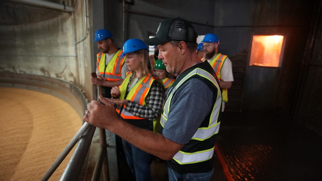 Rahr site operations director Cody Marshall with brewers in Germination Hall.